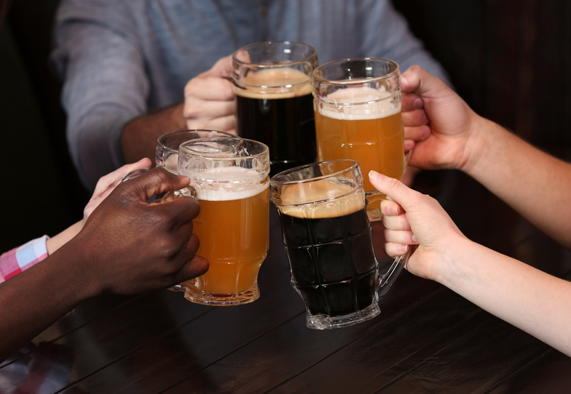 Friends drinking beer in pub Brewery Tours